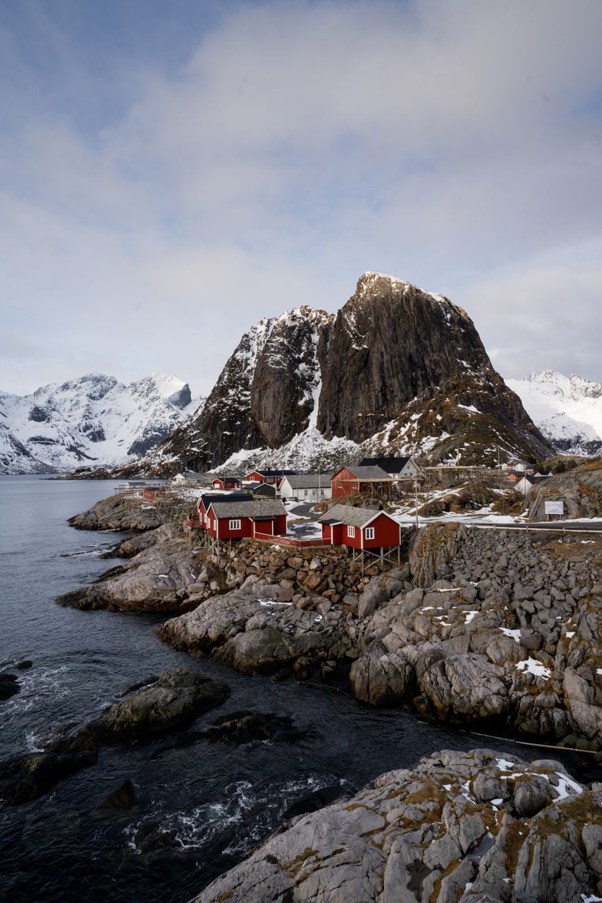 Red rorbu cabins in Lofoten winter snow